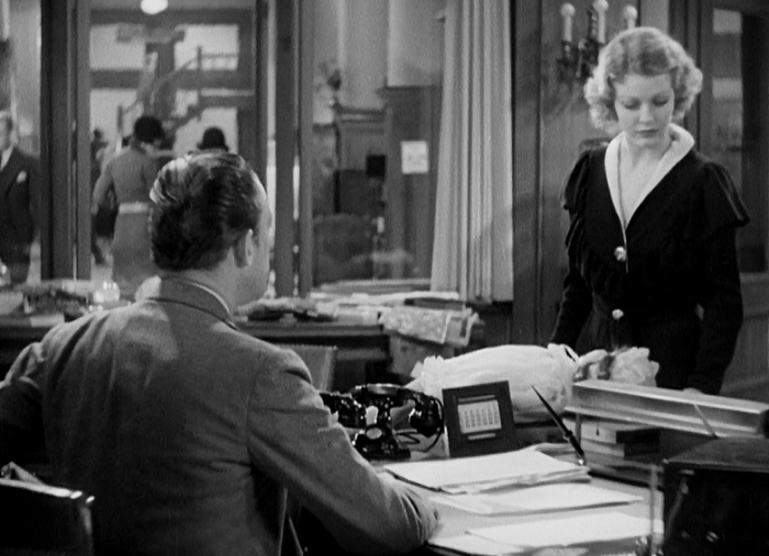 Look, basically every screenshot I've got is Warren William sitting behind a desk. It's that kind of filM! 