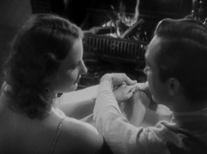 This shot has us peering over John and Florence's shoulders. It's brief, but very intimate. I should have more to say here, but it's just a wonderful moment as he begins to read a Bible verse from reading the braille and she finishes it for him from memory. 