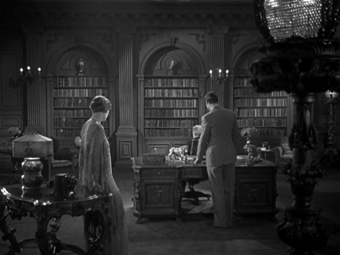 Ralph confesses his love for Kay to his father, putting the whole family at odds with one another. This is a great shot for a 1930 film; it wouldn't make much sense as a scene in a silent movie.