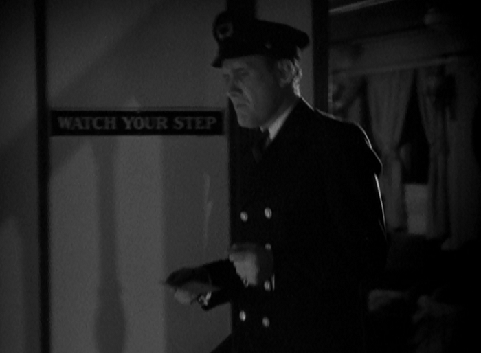 That sign on the wall represents a pretty black gag on Capra's part as the scene before this shows someone losing their step to a near-fatal degree.