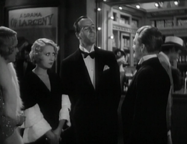 One of the better jokes in the film is that sign behind the quartet of grifters.