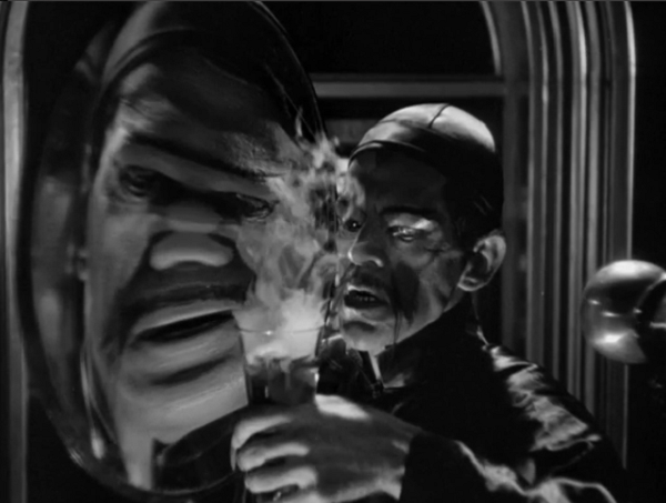 Our first shot of Dr. Fu Manchu, and the hideous warped visage he projects.