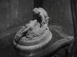 And a nice little pan from suggestive statue, to discarded clothing, to a pair of hands having a nice time.
